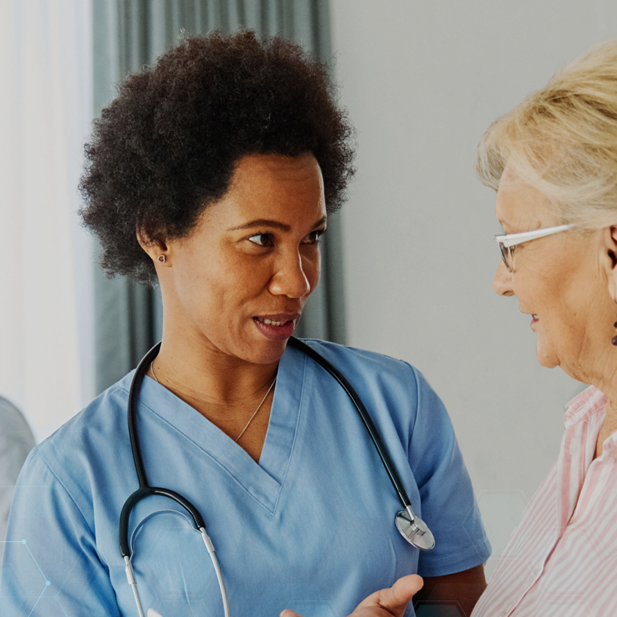 Female doctor speaking with elderly patient